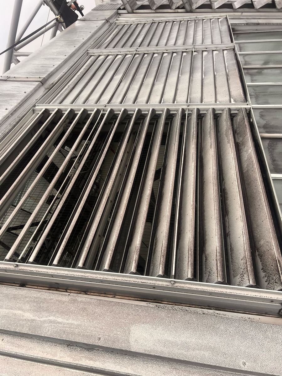 Close-up of a louvred roof vent at Alexandra Palace with its louvres seized open, before the make safe