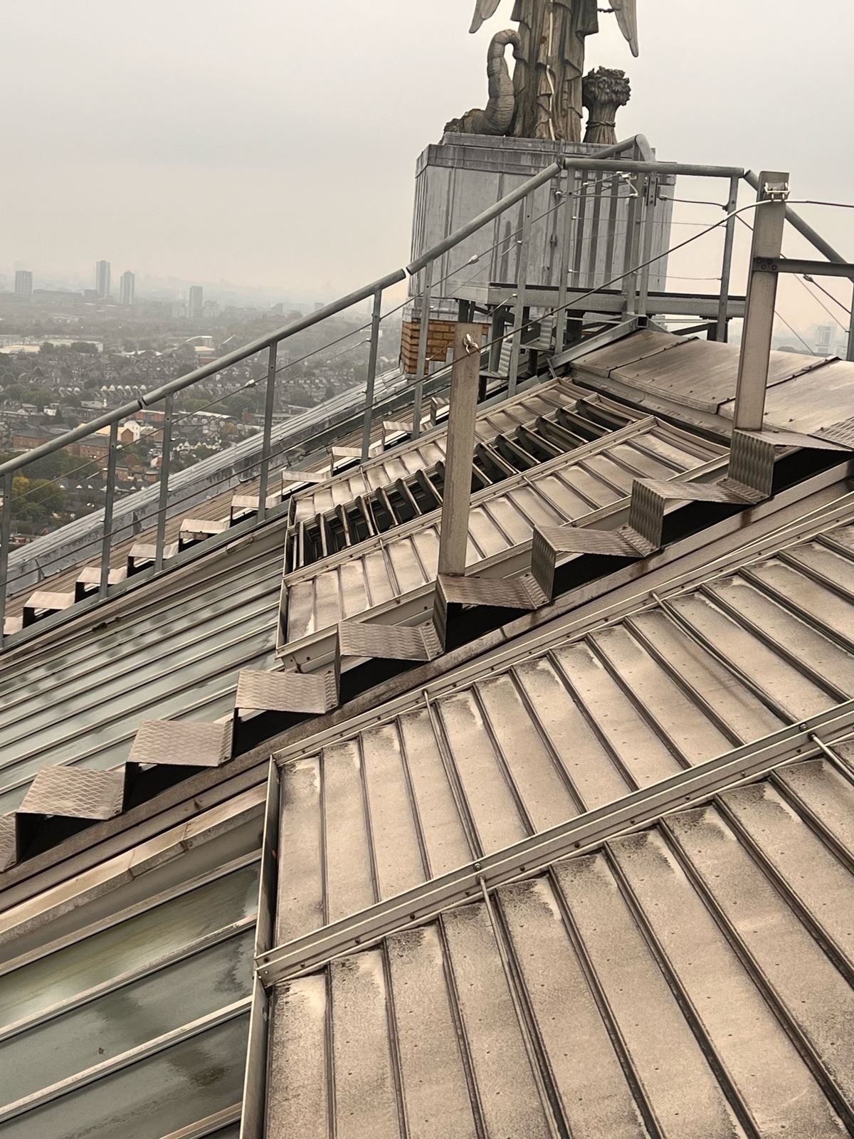 Louvred roof vents on the Alexandra Palace roof with the palace statue behind